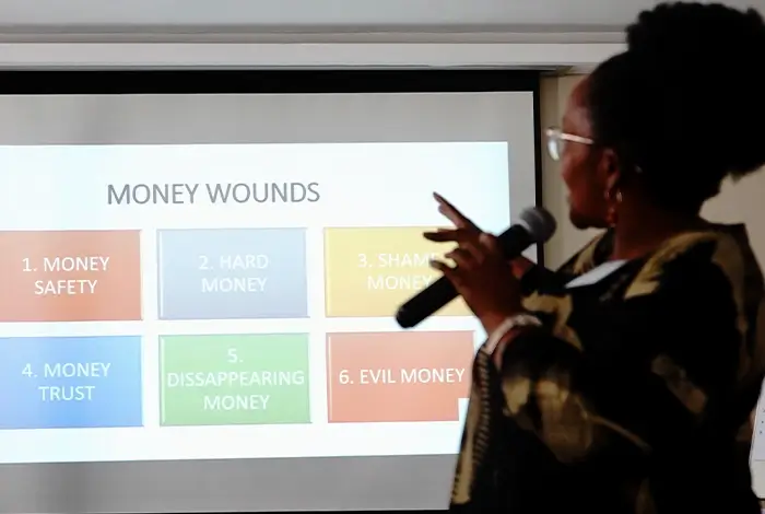 Dr. Nomfundo Mogapi, Clinical Psychologist and CEO of CMWL, presenting on trauma-informed governance and leadership strategies during a professional conference.