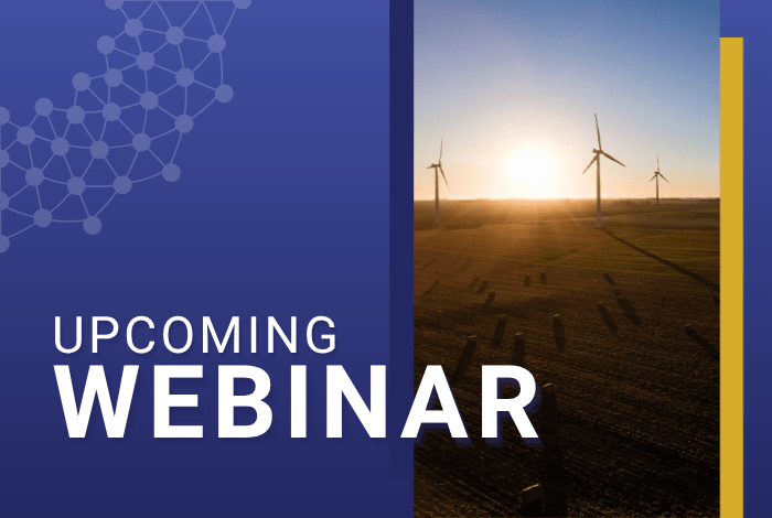 Large wind turbines in a green field at sunset, representing large-scale renewable energy infrastructure. - image for the upcoming webinar: Who Decides? Community authority and large-scale renewable energy in the Global South. Photo by William DeHoogh on Unsplash